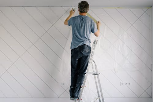 Commercial Painting Contractor Massachusetts for Professional and Lasting Results 1 Commercial painting contractor applying paint on office building walls in Massachusetts